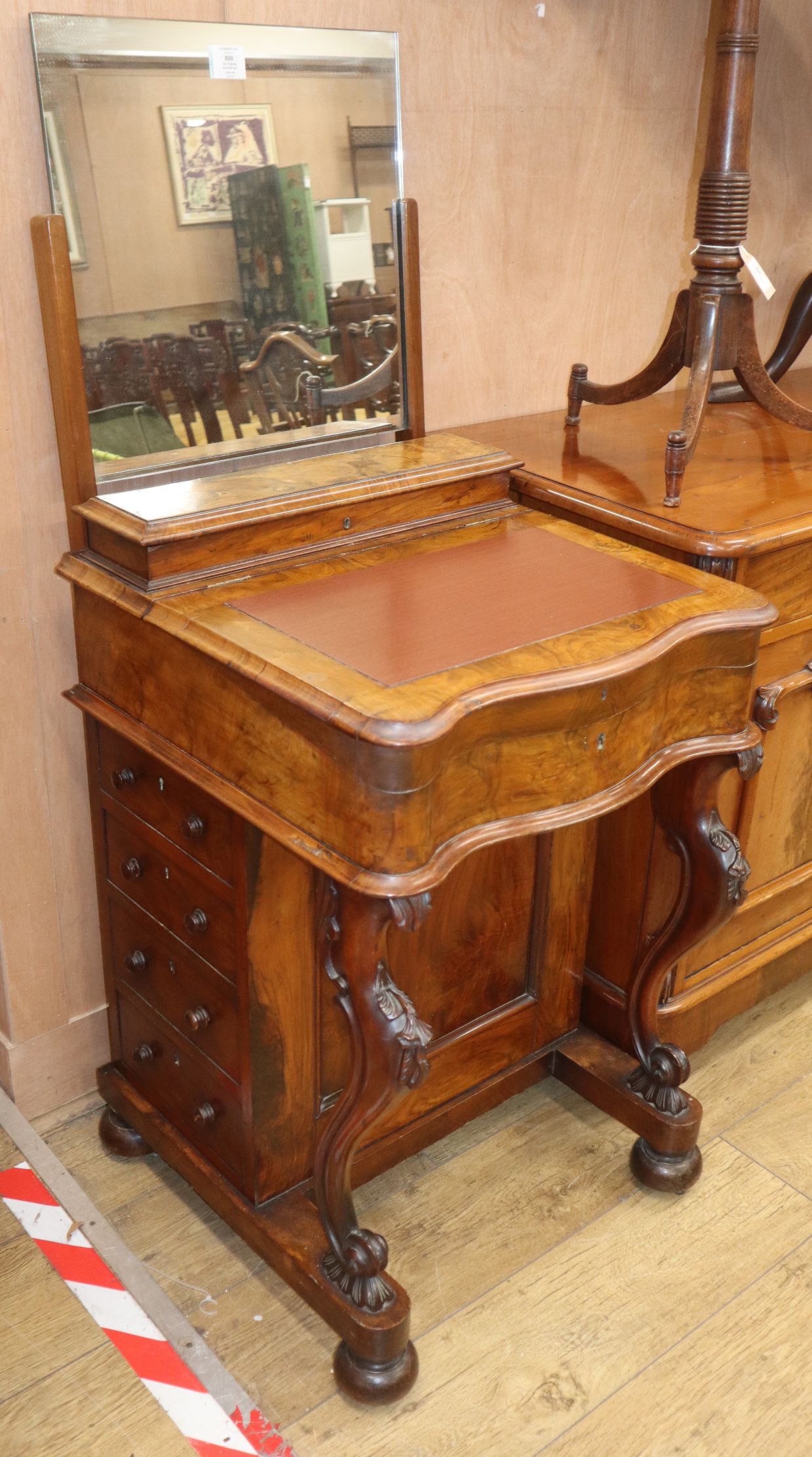 A Victorian walnut davenport, with later mirror back W.56cm