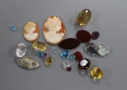 A group of assorted unmounted cut gemstones including small diamonds.