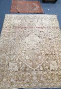 A North West Persian ivory ground floral rug, 180 x 136cm, and a smaller Bokhara mat