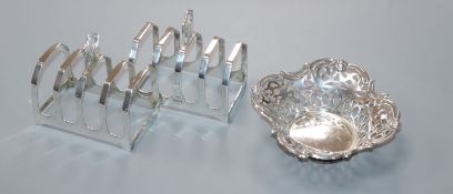 A pair of silver toastracks and a silver bonbon dish.