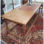 A 17th century style oak refectory table L.229cm