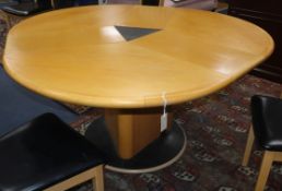 A Skovby Danish segmental extending dining table W.147cm