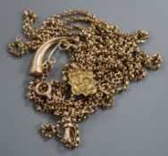 An Edwardian 9ct yellow metal guard chain, with engraved slide and horn charm, gross weight 24.1