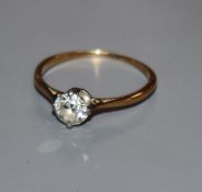 A yellow metal and solitaire diamond ring, the stone weighing approximately 0.45cts, size M.
