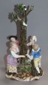 A 19th century Meissen centrepiece of children dancing around a tree incised model number 2628