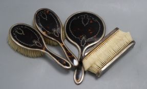 A 1920's silver and tortoiseshell five piece mirror and brush set by Mappin & Webb.