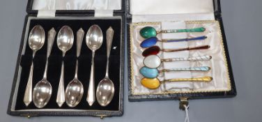 Two cased sets of six tea/coffee spoons including Danish gilt white metal polychrome enamel set
