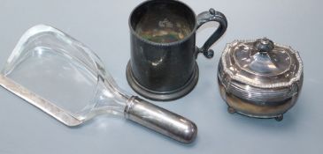 An unusual silver mounted glass crumb scoop, a Victorian silver tea caddy and a Victorian silver