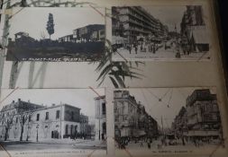 A 1920's Japanese lacquered postcard album with continental topographical cards, thirty one