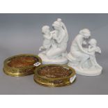 A pair of Sevres biscuit porcelain figures with gilt bronze oval stands, overall height 24cm incl.