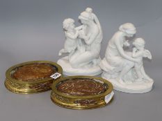 A pair of Sevres biscuit porcelain figures with gilt bronze oval stands, overall height 24cm incl.