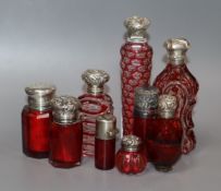 Nine assorted silver or white metal mounted glass scent bottles, including ruby glass, Bohemian &