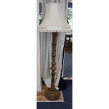 A carved walnut standard lamp