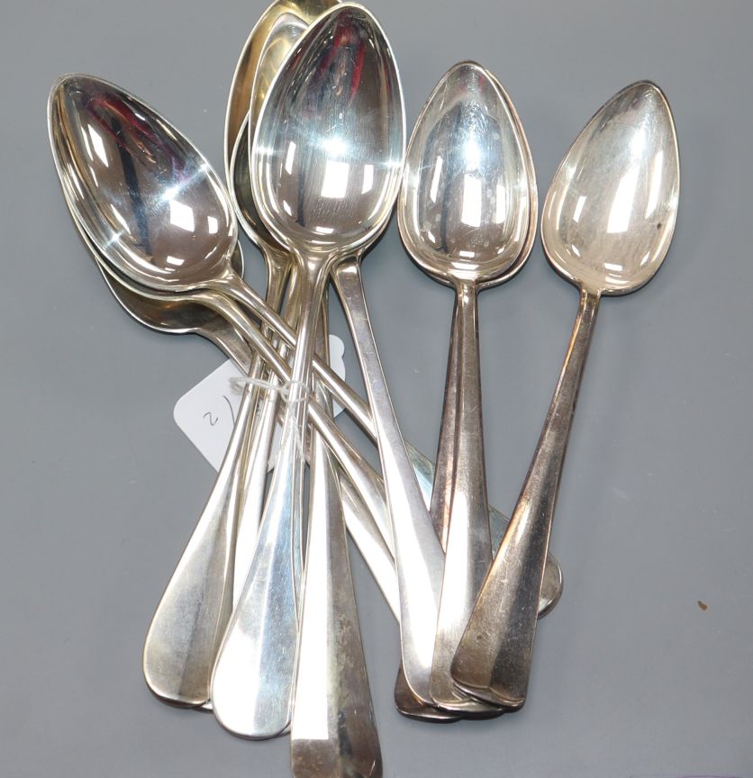 Nine assorted Dutch/German white metal table/serving spoons and three plated spoons. 21.5 oz.