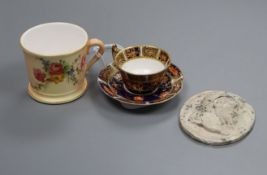 A miniature Royal Worcester mug, a miniature Royal Crown Derby cup and saucer and a Wedgwood and