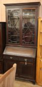 An Edwardian blind fret carved mahogany bureau bookcase, W.102cm