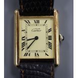 A lady's silver gilt Must de Cartier manual wind rectangular wrist watch, with Roman dial, on