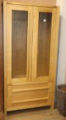 A contemporary oak display cabinet W.95cm