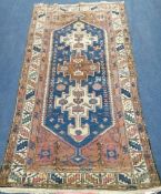 A Persian blue ground rug, 195 x 97cm