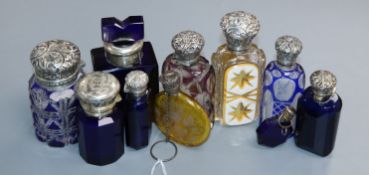 Ten assorted late 19th/early 20th century silver or white metal mounted coloured glass scent