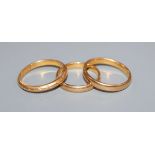 Three 22ct gold wedding bands, gross 8.9 grams.