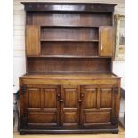 An 18th century and later panelled oak dresser, with boarded rack W.171cm