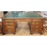 A George III style walnut pedestal desk W.168cm