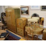 A 1930's blond walnut seven-piece bedroom suite decorated with silvered metal swags, comprising: