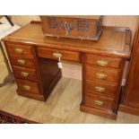 A late Victorian mahogany kneehole desk of nine drawers W.122cm