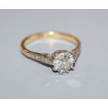 A diamond solitaire ring, in plat and 18ct with diamond-set shoulders, original ivorine box, size