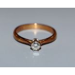 A modern 18ct gold and diamond solitaire ring, size N.