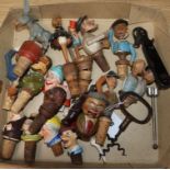 A collection of mixed ceramic and wooden bottle stoppers, two corkscrews etc