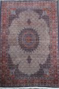 A North West Persian blue ground carpet, with central medallion in a tightly packed field of foliate