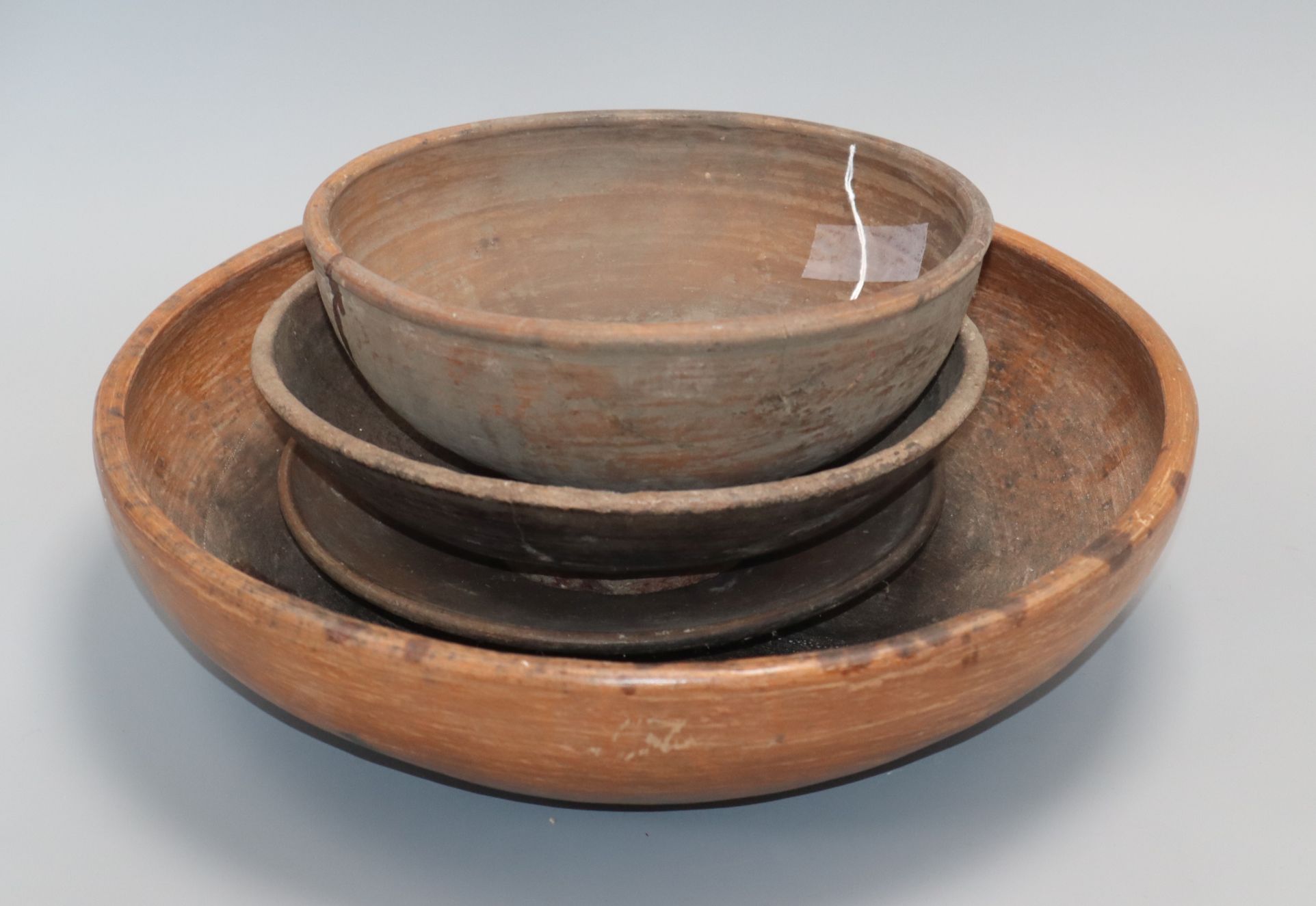 Two Chinese Straits brown-glazed bowls and two dishes