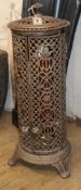 A cast iron conservatory heater with pierced side H.79cm