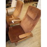 A pair of Gimson and Slater 'rock'n'rest' teak reclining chairs (one a.f.)