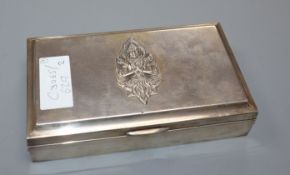 A Thai sterling white metal cigarette box and a small circular silver photograph frame.