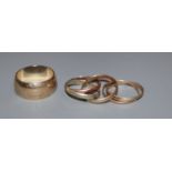 A 'Russian' 9ct three colour gold wedding ring, one other unmarked 'Russian' ring and a modern 9ct