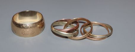 A 'Russian' 9ct three colour gold wedding ring, one other unmarked 'Russian' ring and a modern 9ct