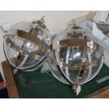 A pair of Laura Ashley contemporary glass and chrome spherical ceiling lights