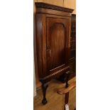A George III mahogany corner cupboard, on later stand W.89cm