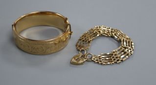 A 9ct gold gatelink bracelet with padlock clasp and a 1/5th - 9ct gold engraved bangle, bracelet