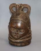 An African carved wood helmet mask height 28cm