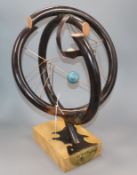 Sam Fanaroff. A copper orrery "An other Dimension", maple based, numbered 0010 height 47cm