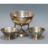 A modern Arts & Crafts style planished silver bowl on stylised supports by Francis Howard Ltd and