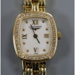 An 18ct gold ladys' Longines wristwatch with cushion-shaped grain-set diamond bezel and integral