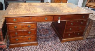 A late 19th century mahogany partner's desk fitted drawers and cupboards L.182cm