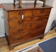 A George III mahogany chest fitted two short drawers and three long drawers on shaped bracket