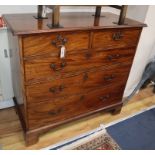 A George III mahogany chest fitted two short drawers and three long drawers on shaped bracket