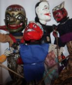 Four Indonesian painted wood puppets